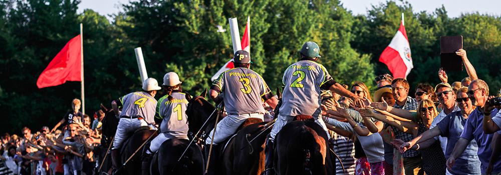 Pittsburgh Team High Fives the Crowd Following a Newport International Polo Series Match